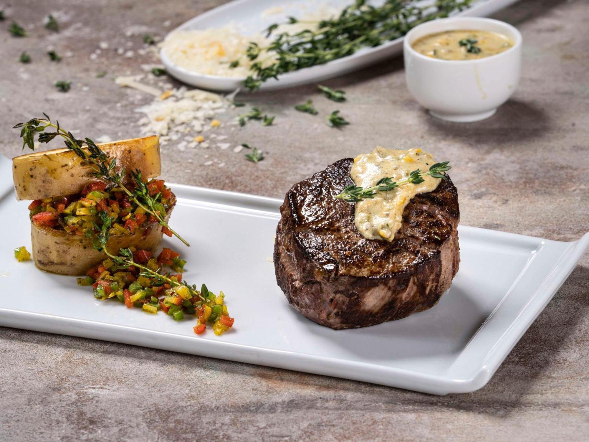 Movenpick Hotel And Residences Riad Exterior foto A steak prepared with a butter sauce